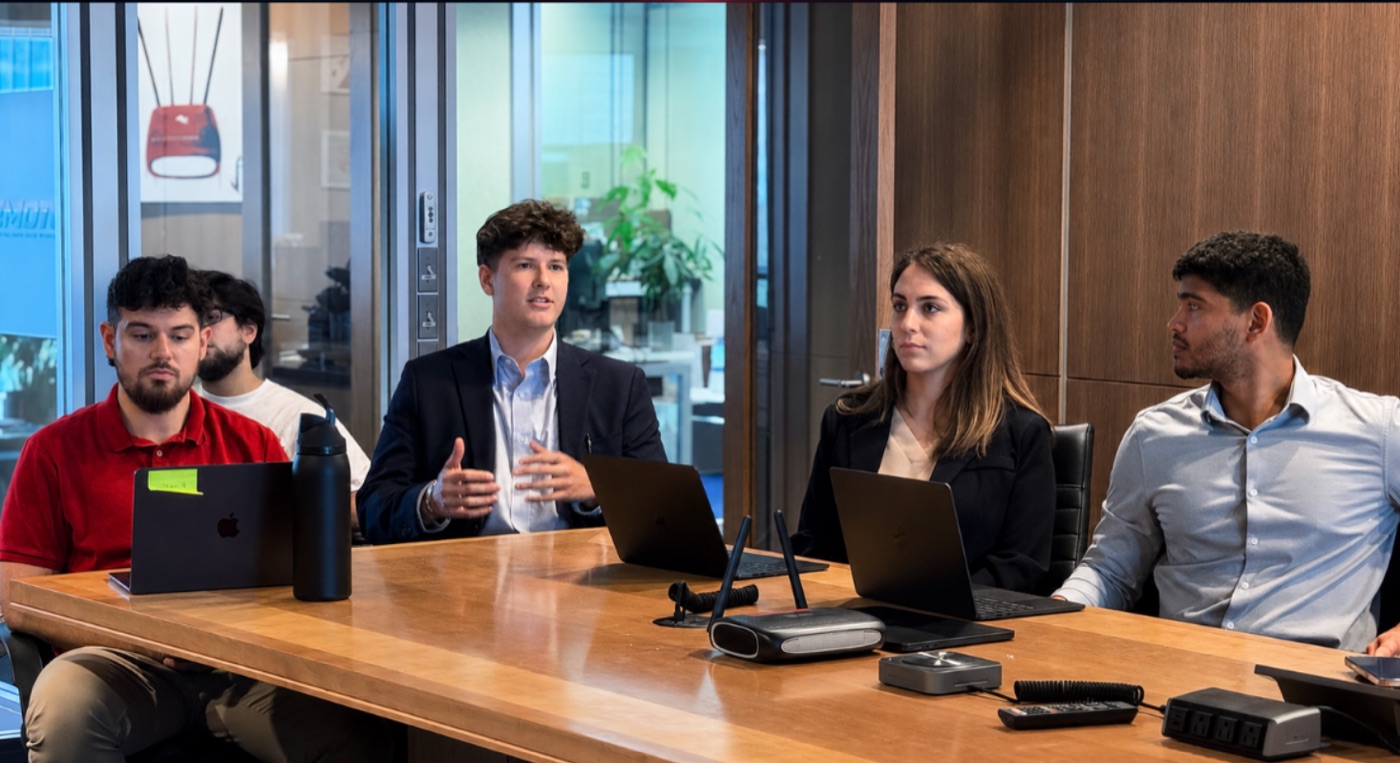 Adrianne with the engineering team in a conference room